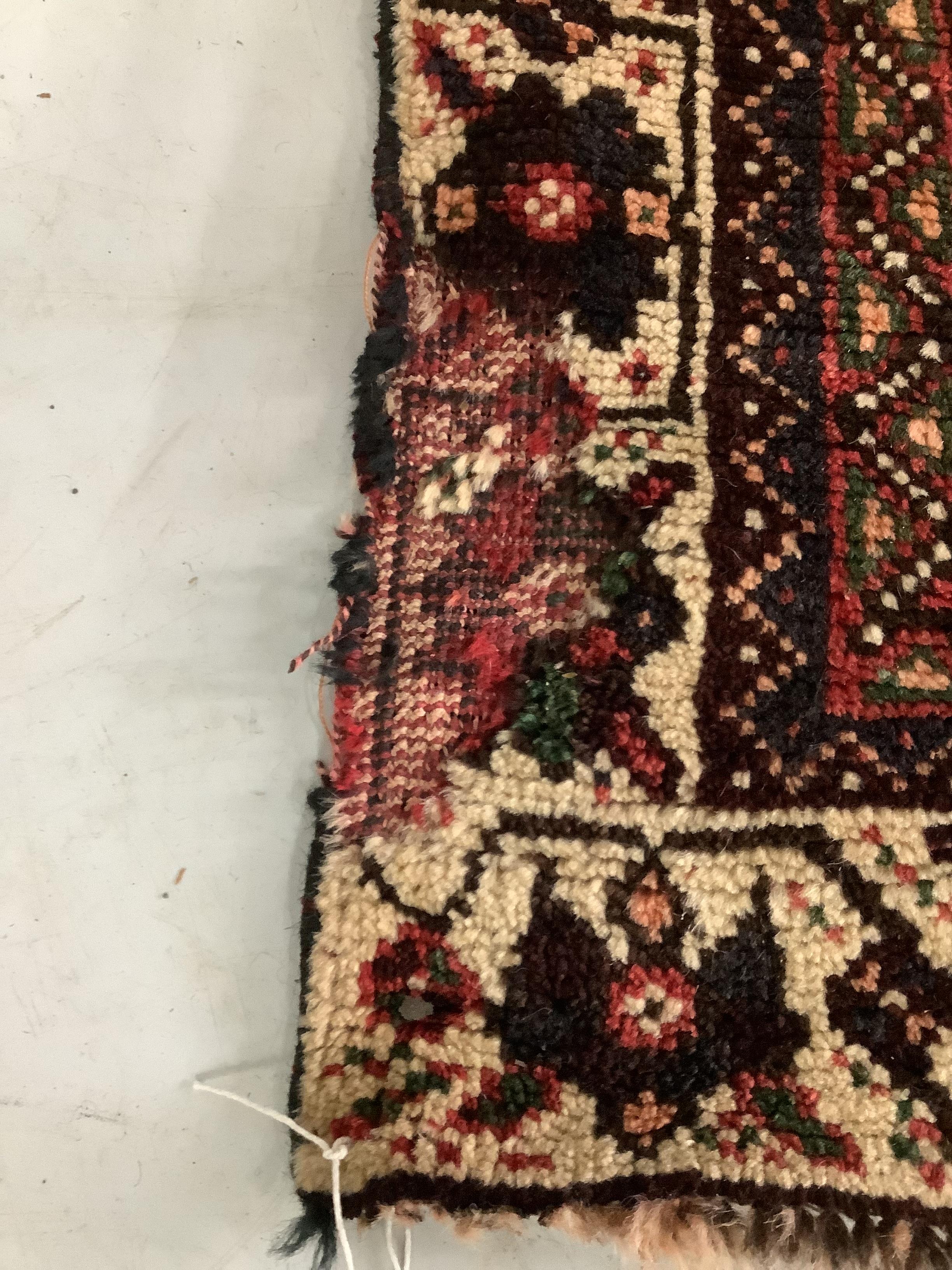 A North West Persian red ground carpet, 290 x 190cm